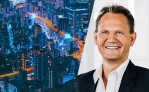 A photo illustration of a city at night alive with connected data and a headshot of a businessman with a sport jacket on